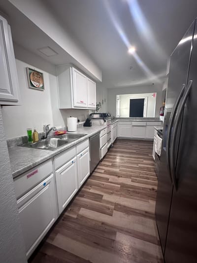 Interior kitchen with white cabinets and appliances