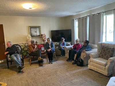 Residents chatting in a common area.