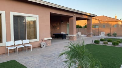 Outdoor patio area with seating and pool table