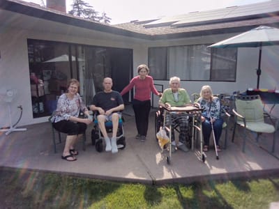 Residents and staff enjoying the outdoor space.