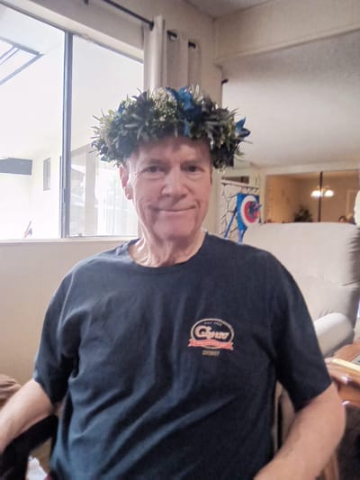 Resident wearing a floral crown in a common area