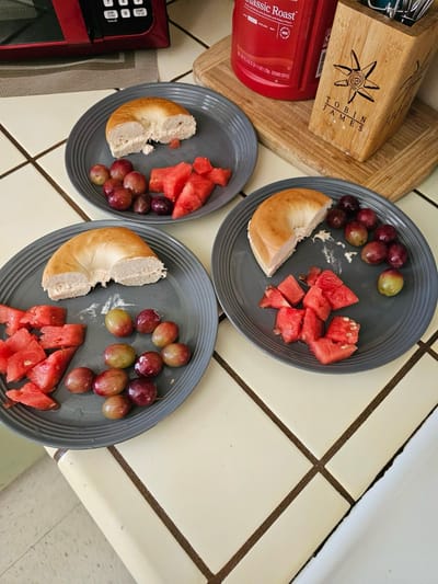 Food items on plates in a kitchen setting.