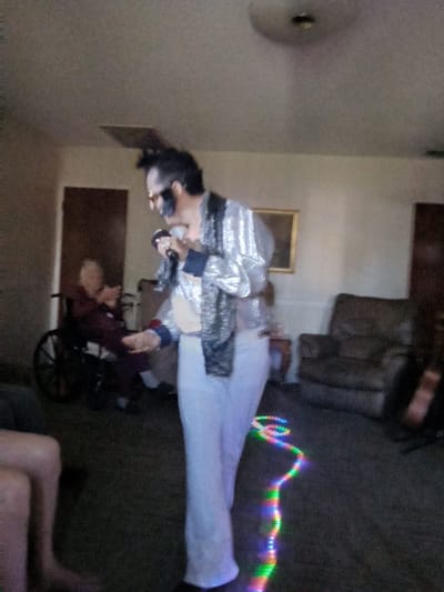 Entertainer performing for residents in a common area
