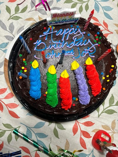 A colorful birthday cake with candles