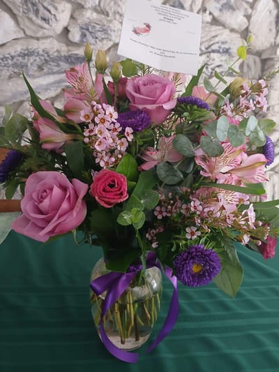 Vibrant floral arrangement with greeting card