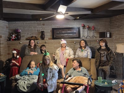 Residents and staff celebrating together indoors