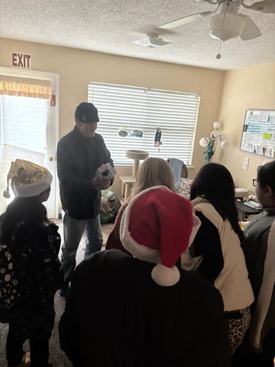 Residents interacting during a holiday celebration.