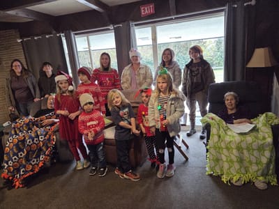Residents and children participating in a holiday event.