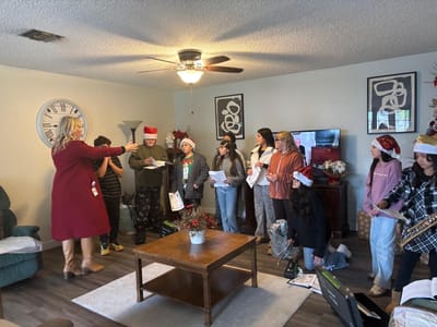 Residents participating in a holiday activity indoors.