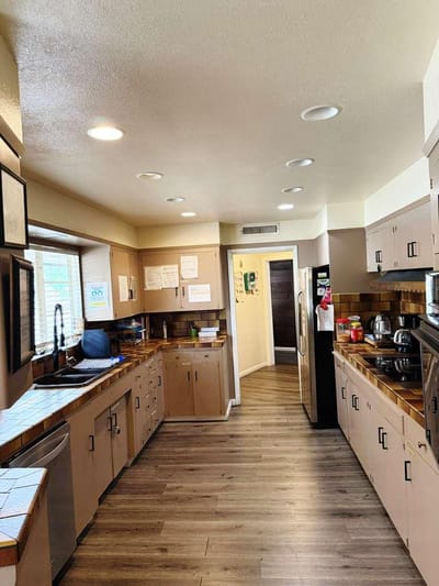 Bright kitchen area with appliances and cabinets