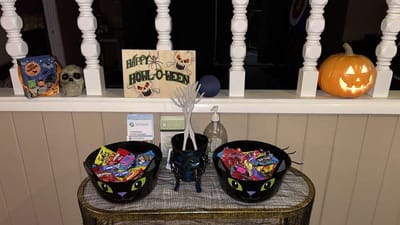 Halloween decorations with candy bowls and a jack-o'-lantern