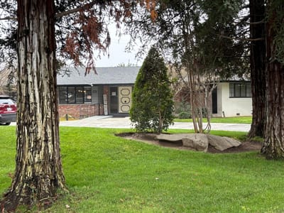 Exterior view of a facility surrounded by greenery.