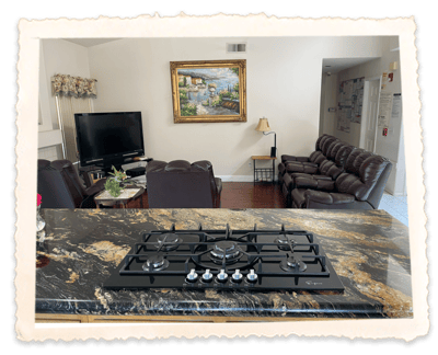 Interior view of a lounge area with a kitchen island.