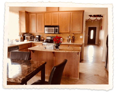 Modern kitchen interior with wooden cabinets and countertop.