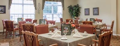 Dining area with neatly set tables and decor