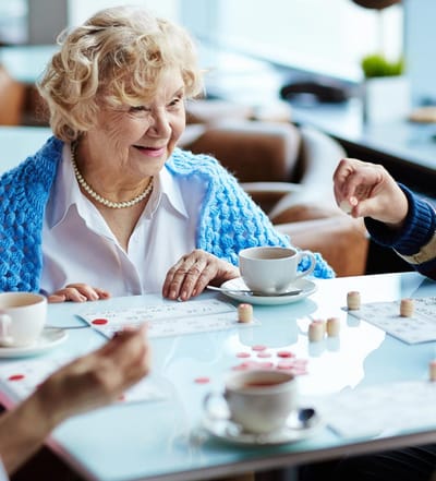 Residents playing a game together in a common area