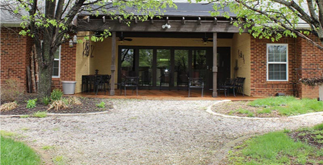 Exterior view of the entrance with outdoor seating