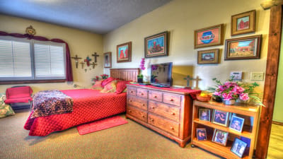 Cozy resident room with personal decorations and a bed