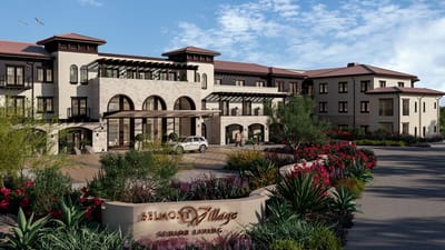 Exterior view of Belmont Village in a landscaped setting
