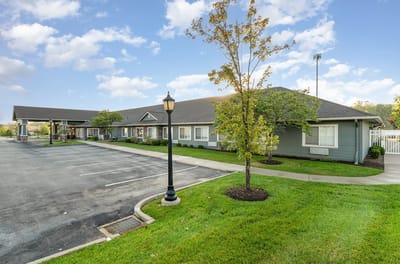 Exterior view of Barathaven Memory Care facility with landscaped area