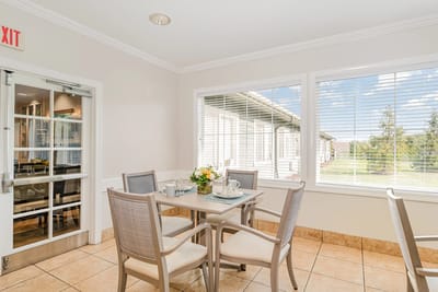 Bright common area with seating and outdoor view