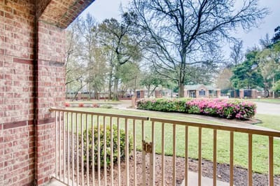 View from a balcony overlooking landscaped gardens