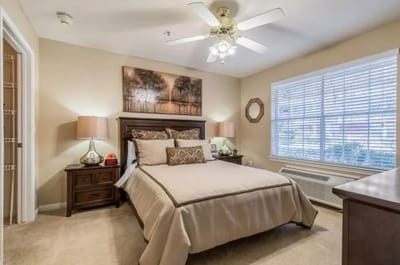Cozy interior of a private resident room with a bed
