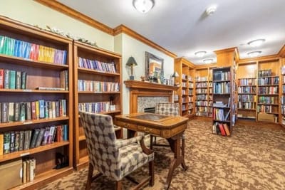 Cozy library with bookshelves and a reading area