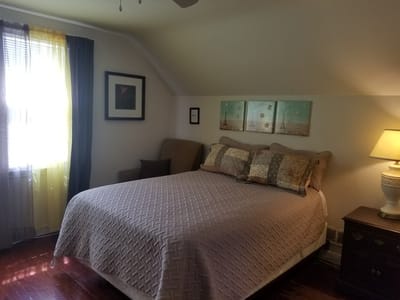 Cozy bedroom setup with a bed and natural light