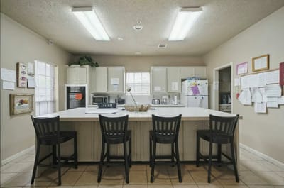 Bright kitchen area with seating and appliances
