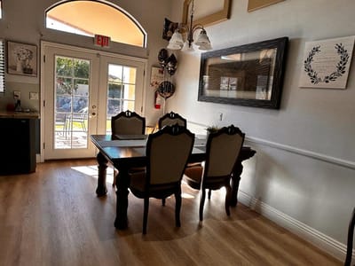 Interior view of a dining area with a table and chairs