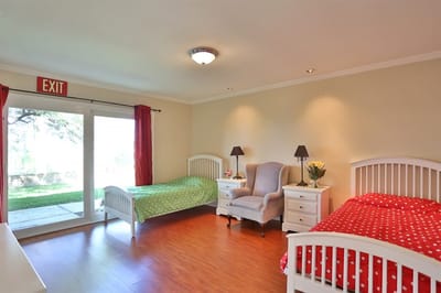 Bright resident room with two beds and a view