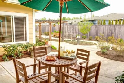 Outdoor seating area with a table and umbrella