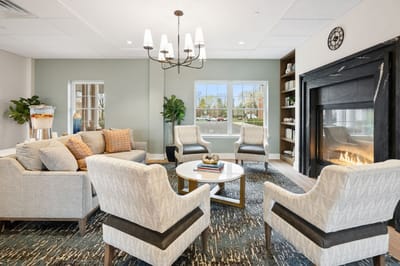 Bright common area with comfortable seating and a fireplace