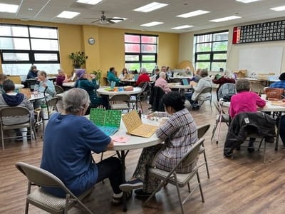 Residents participating in a bingo game in a common area