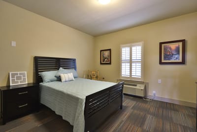 Private resident room with bed and furnishings