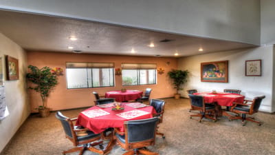 Bright interior of a common area with dining tables and decor