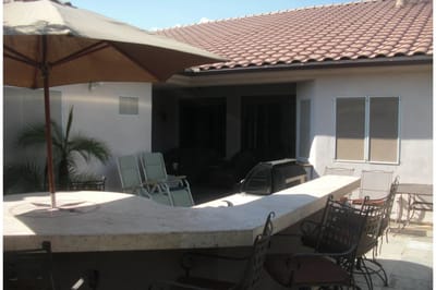 Outdoor patio area with seating and umbrellas