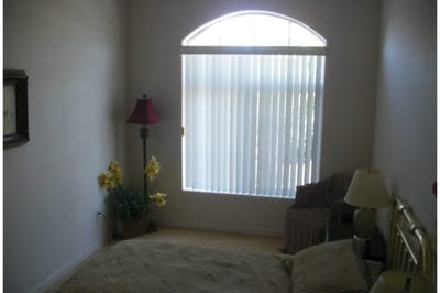 A cozy resident room with light from a window