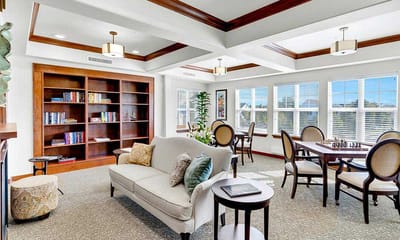 Bright common area with seating and bookshelves