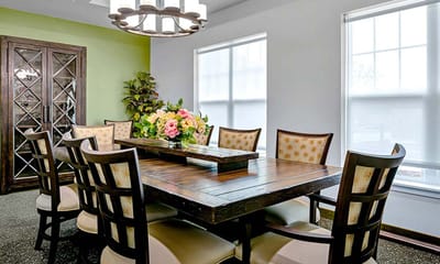 Dining area with a large wooden table and chairs