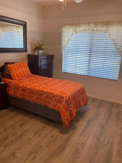Cozy private room with warm colors and window