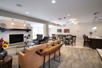 Bright common area with seating and dining space