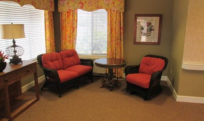 Cozy sitting area with colorful curtains and chairs