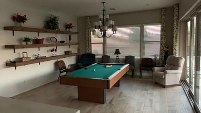 Interior common area with a pool table and seating