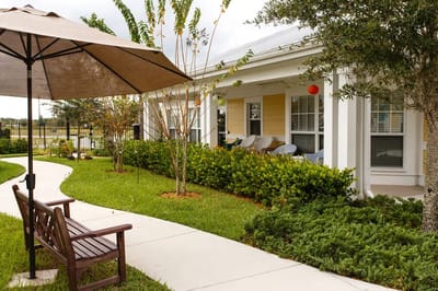 Pathway and seating area in a landscaped outdoor space