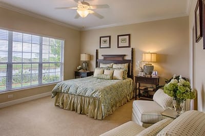 Cozy resident room with a bed and seating area