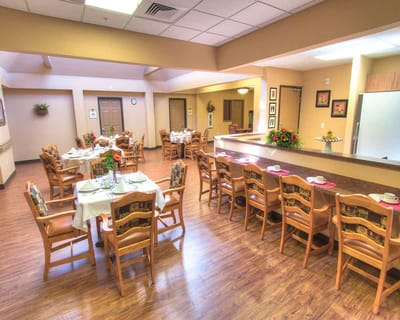 Bright dining room with tables set for meals