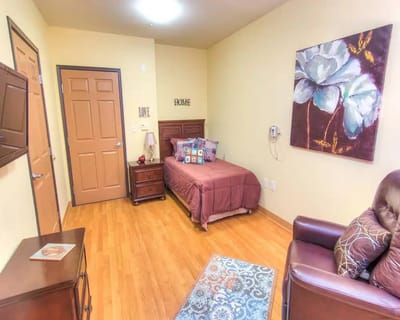 Cozy private resident room with a bed and decor