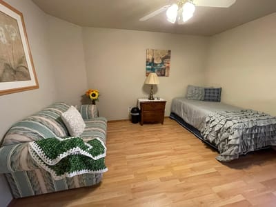 Cozy resident room with a bed and sofa